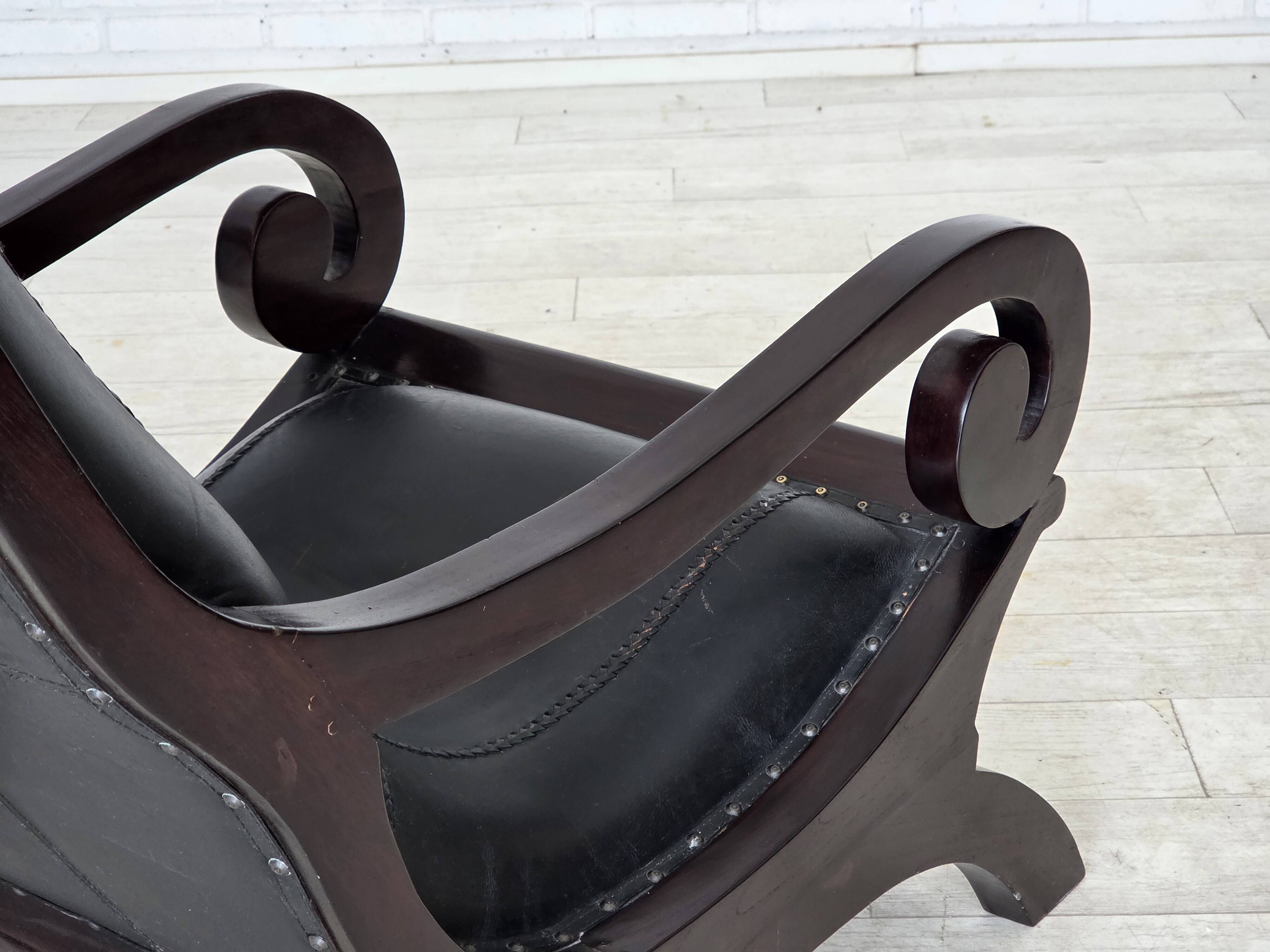 1970s, vintage armchair with footstool, black furniture leather.