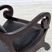 1970s, vintage armchair with footstool, black furniture leather.