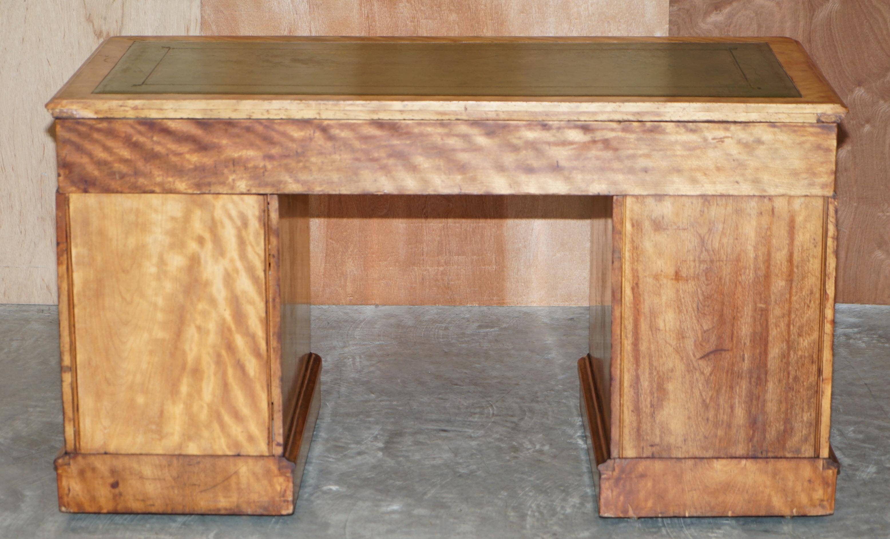 Antique desk by James Winter & Sons London in satin wood and leather.