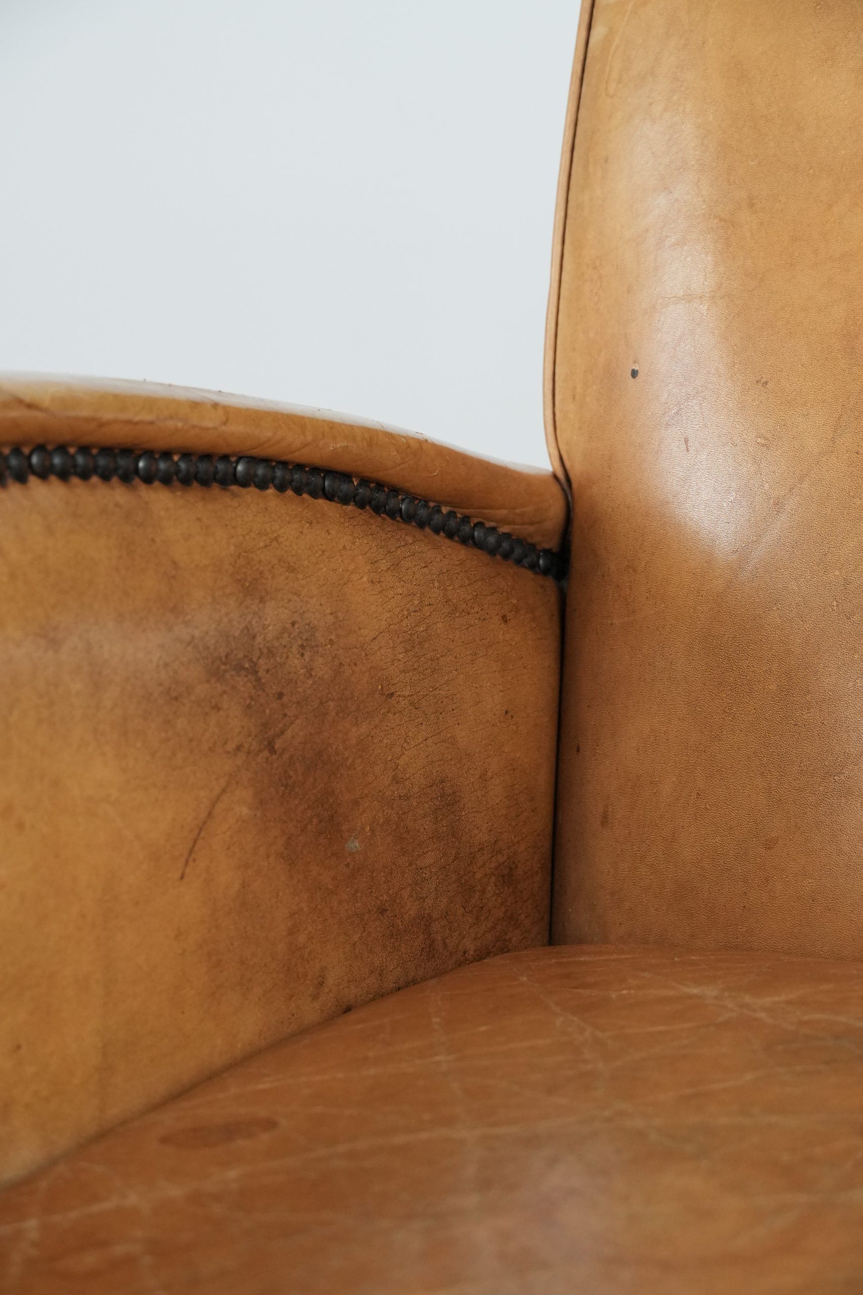 Luxury armchair made of cowhide leather with a beautiful warm colour scheme