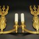 Large pair of wall sconces with winged caryatids in Empire style - gilded bronze