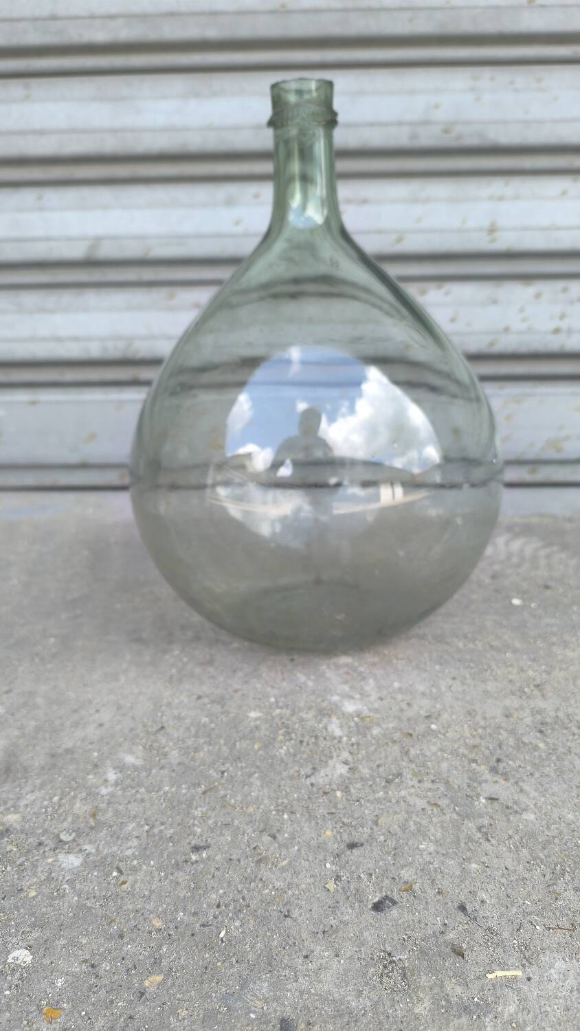 Green demijohn in blown glass