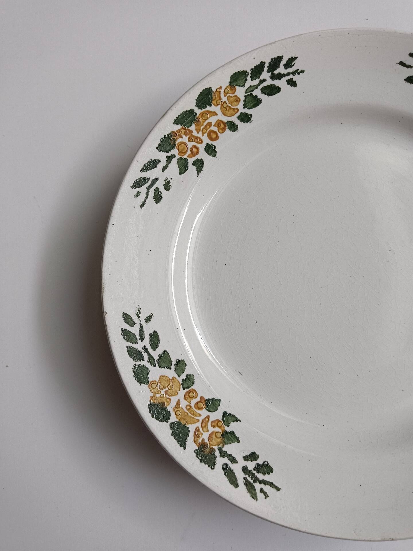 Old round footed plate signed Labrut brothers flowers