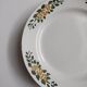 Old round footed plate signed Labrut brothers flowers