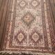 Hand-knotted silk carpet purchased in Iran – geometric and animal design –