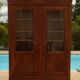 Chic old bookcase pegged in walnut with two glass doors and 5 shelves – Very good condition