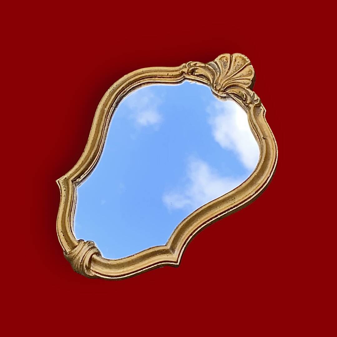 Small vintage rockery wall mirror in golden resin