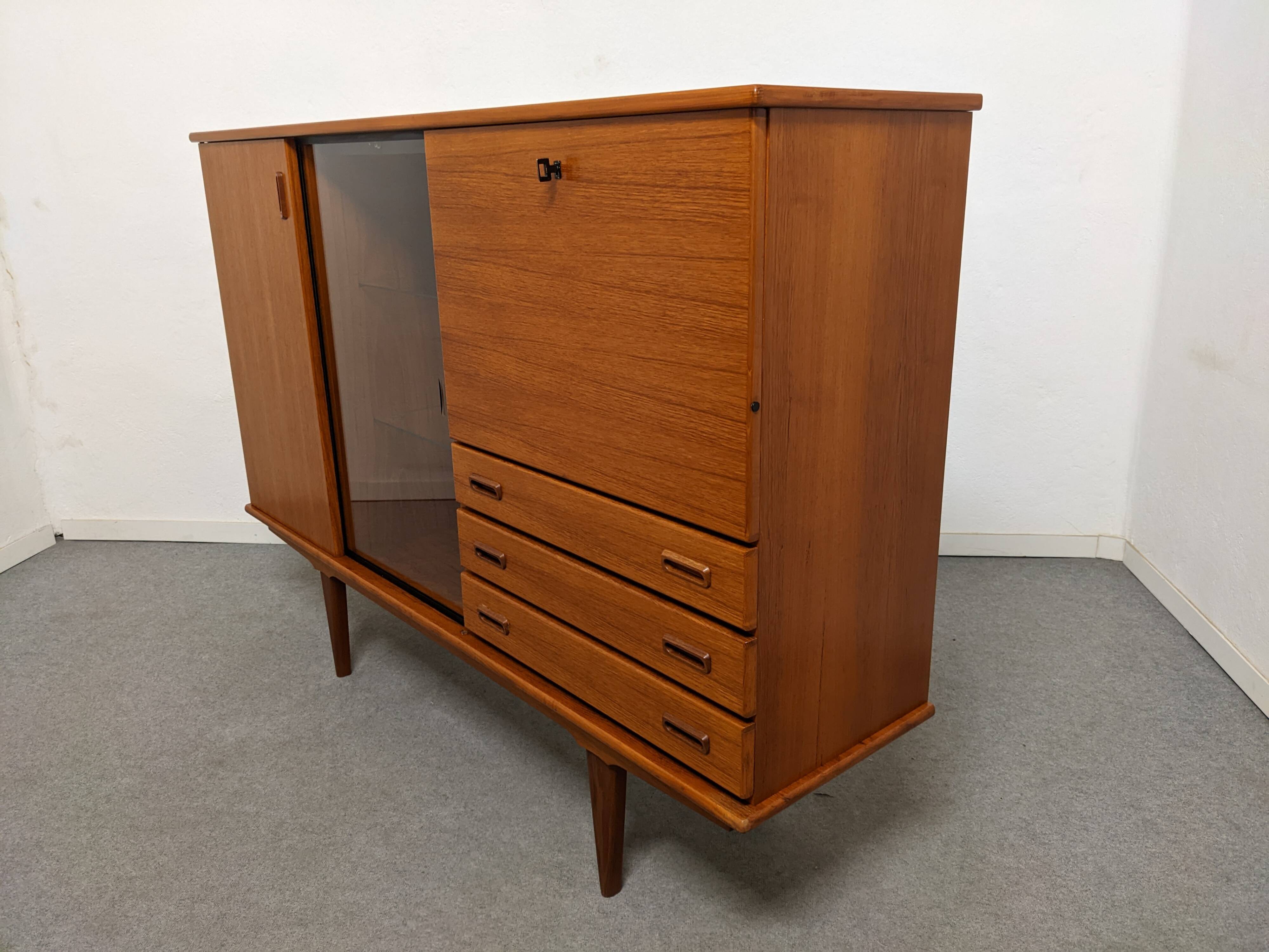 High sideboard, display cabinet and secretary, Scandinavian in teak, France around 1960.