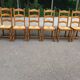 6 solid oak dining chairs with rush seats from the 1980s.