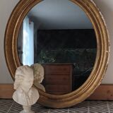 Antique oval gilded stucco mirror