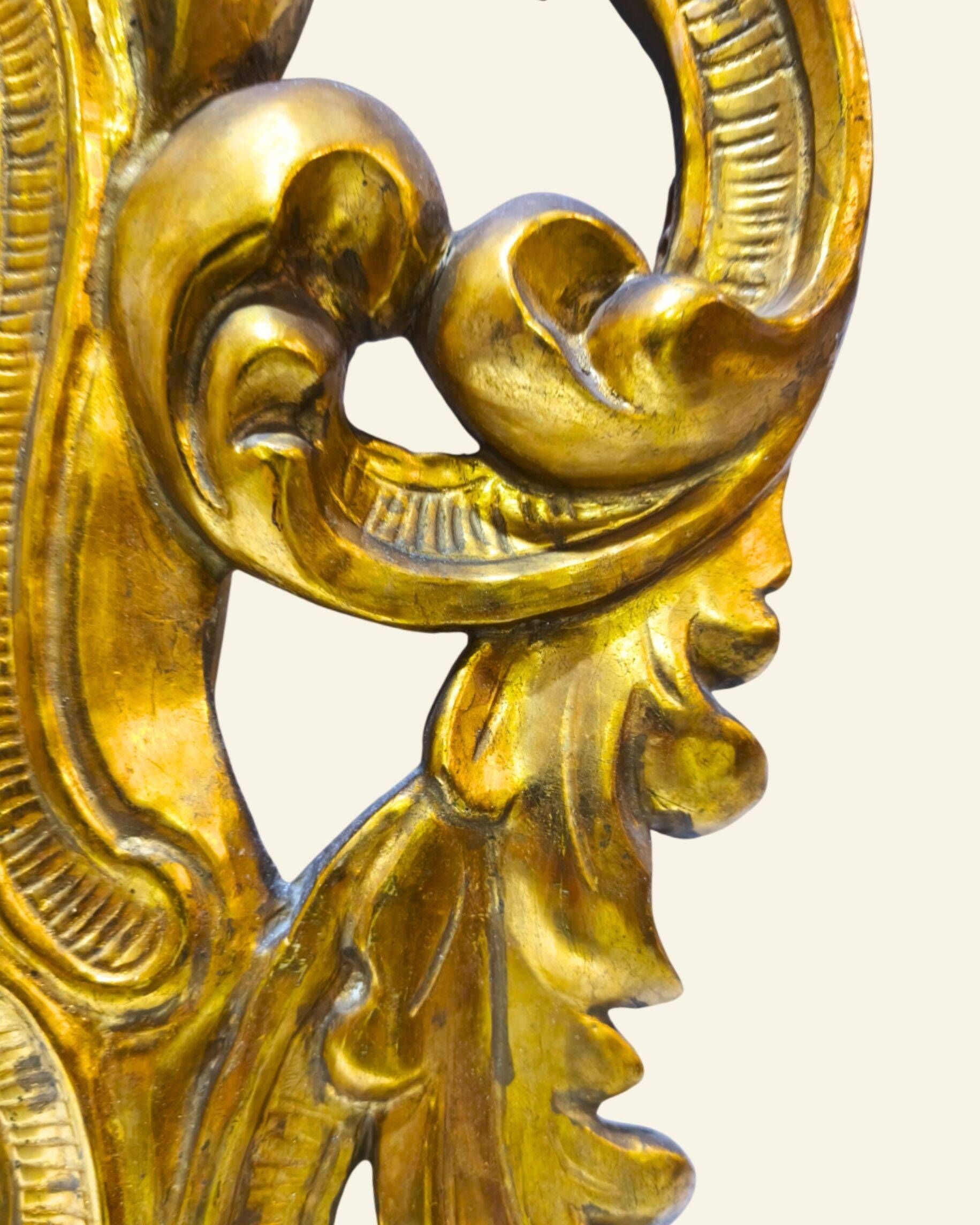 Antique wall mirror in carved and gilded wood, baroque style, 140 × 115 cm