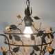 Patinated metal ceiling light with a floral and leaf pattern, 1950s, Italy.