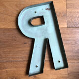 Ancient letter r sign metal painted