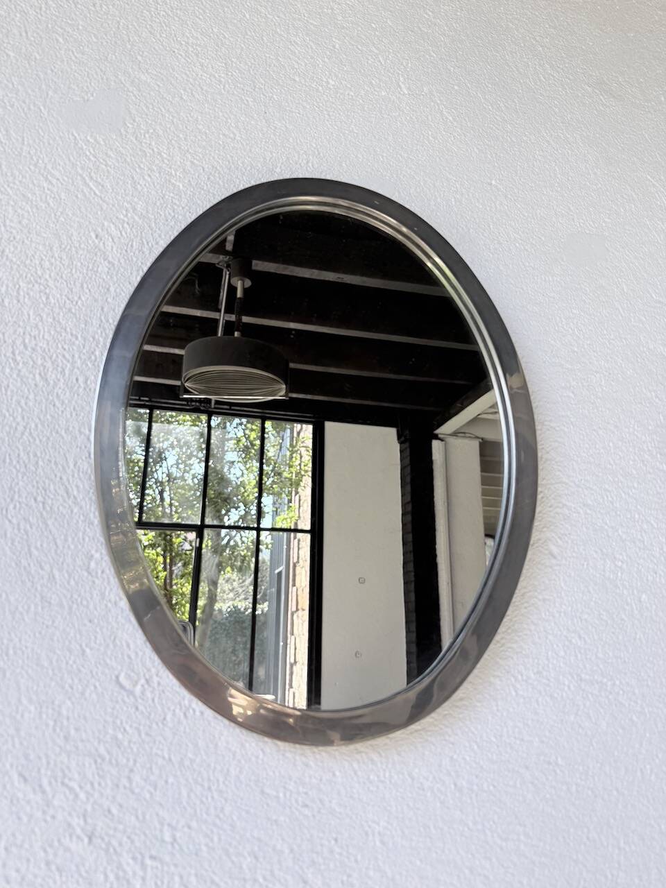 Miroir en métal argenté ovale 1950