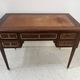 Louis XVI style desk in mahogany and mahogany veneer, 20th century.