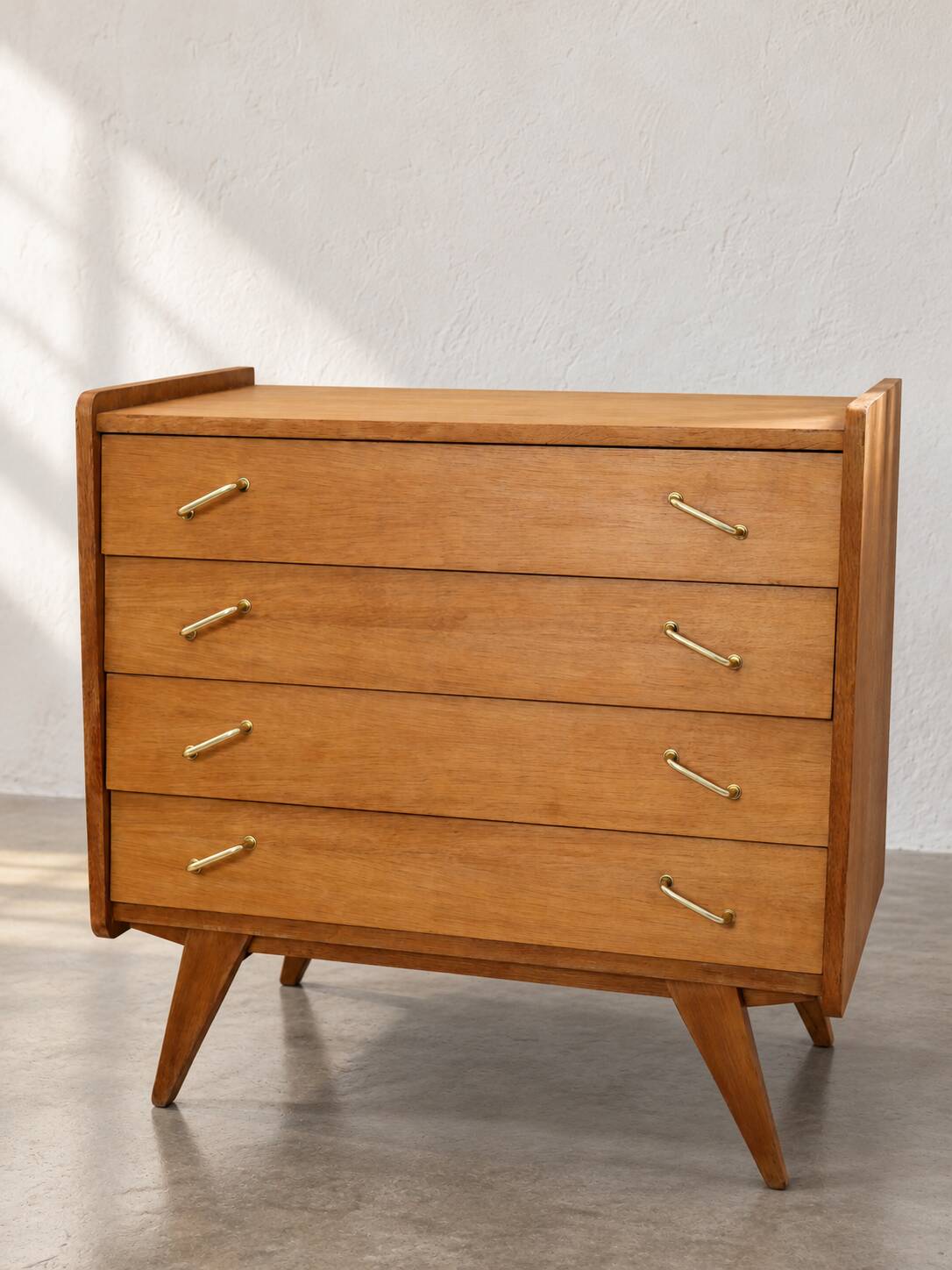 Vintage 1960s commode with tapered legs.