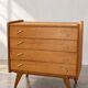 Vintage 1960s commode with tapered legs.