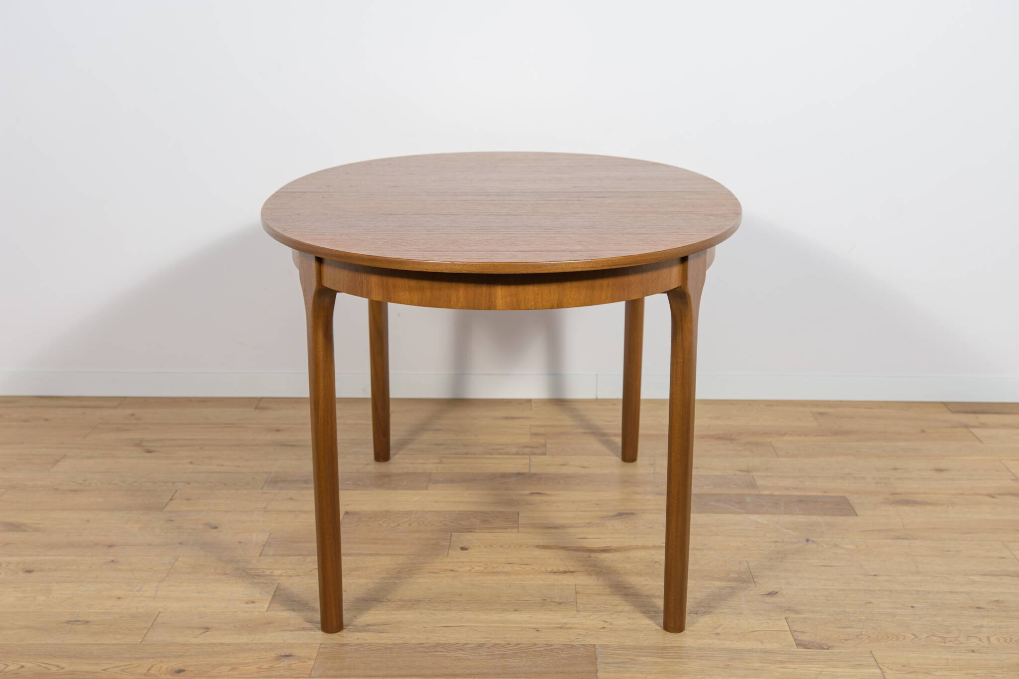 Mid-century extendable oval teak dining table from McIntosh, UK