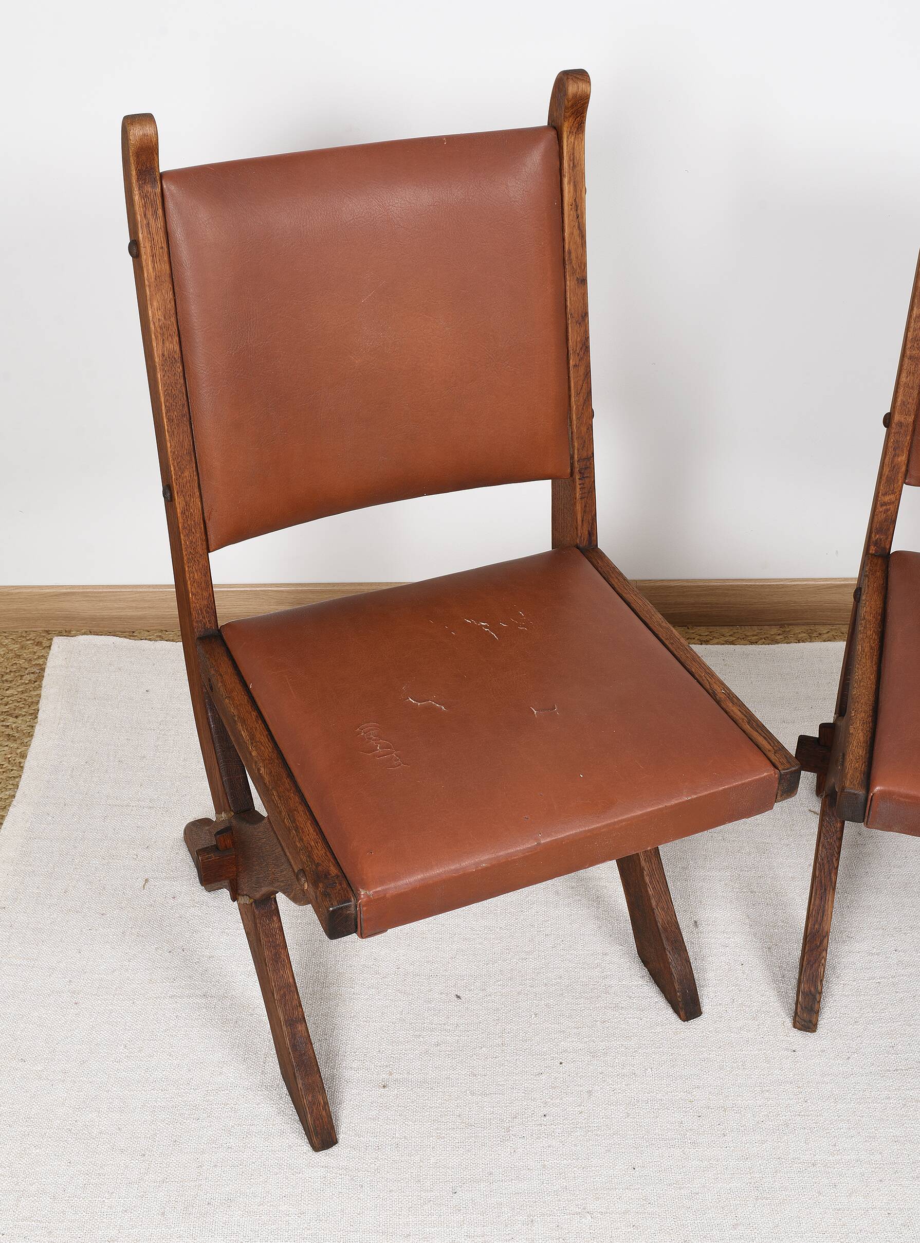 Pair of brutalist style chairs, in wood and leather.