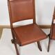 Pair of brutalist style chairs, in wood and leather.