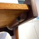 Table d'appoint sculpturale sur roulettes, bois massif, années 1950