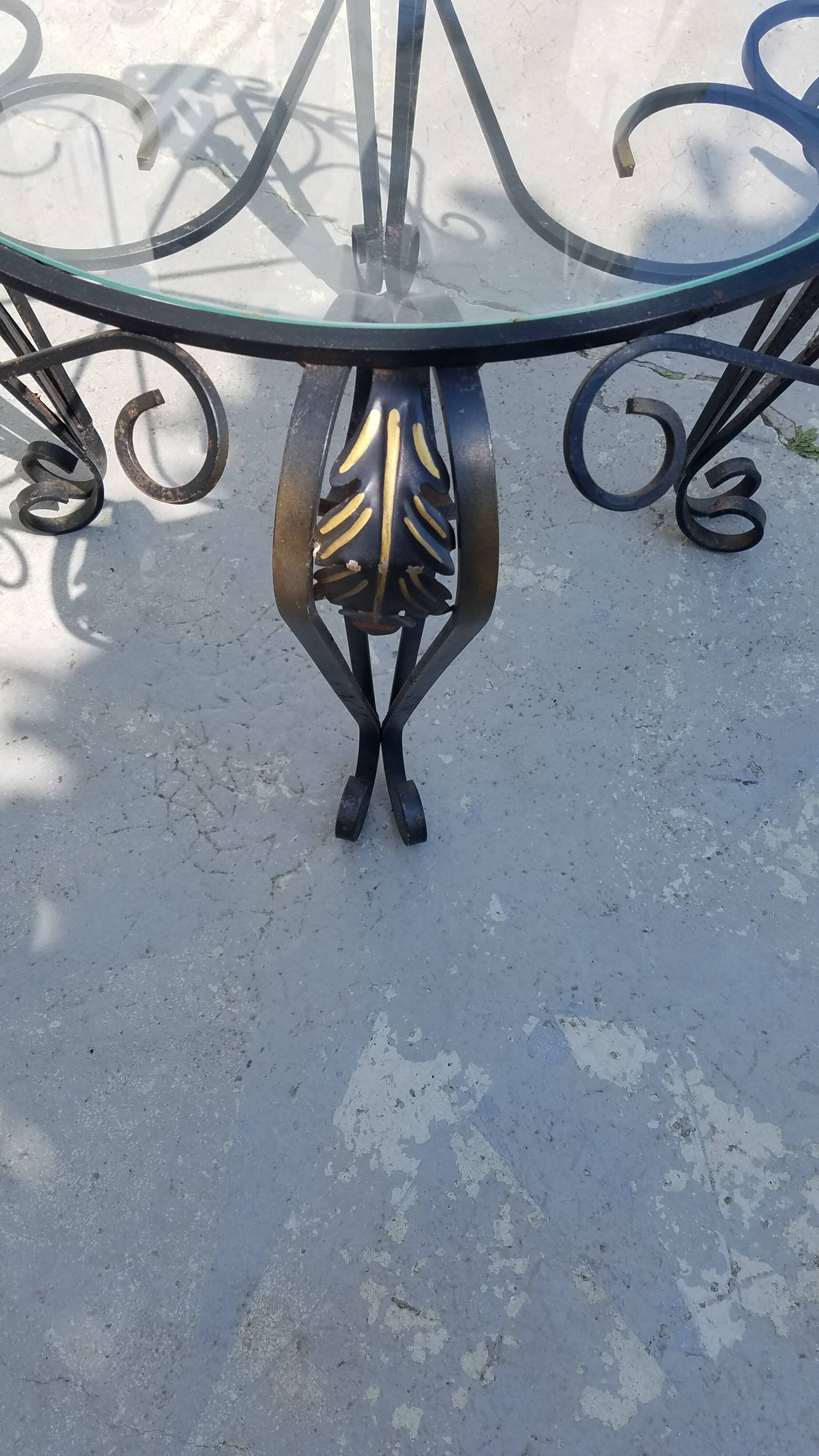 Wrought iron and glass round table