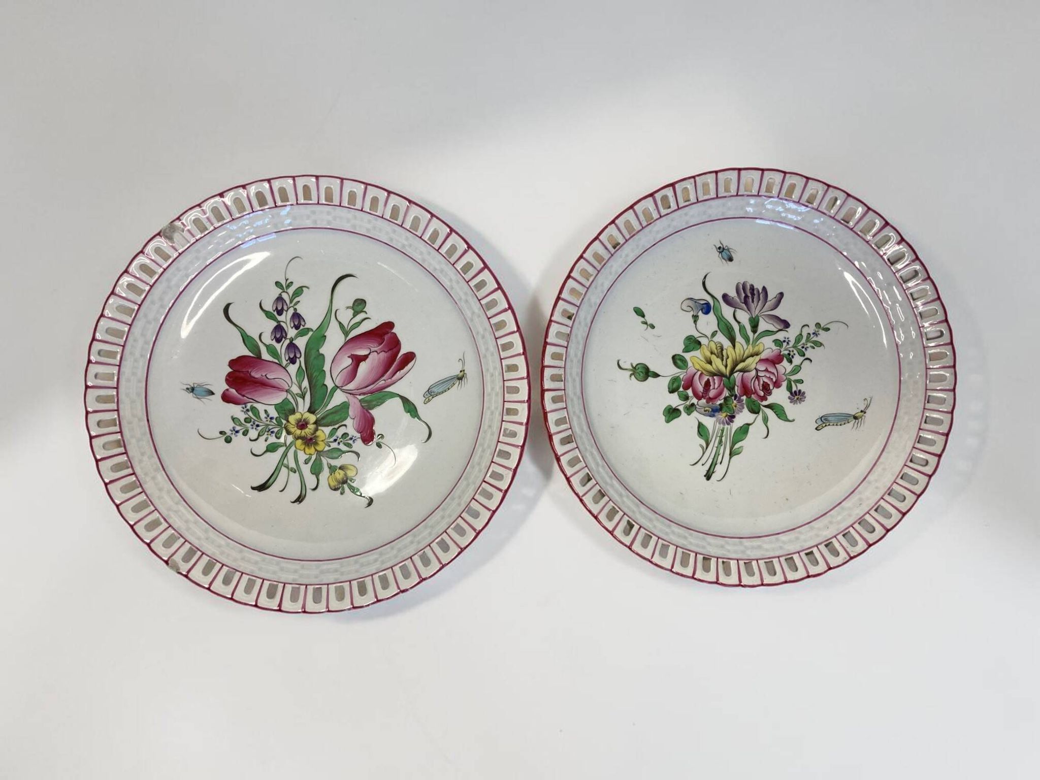Lunéville, two floral earthenware bowls with pierced edges from the early 20th century.
