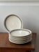 Set of 9 blue and beige striped plates.