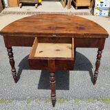 Half moon console opening on a solid walnut round table