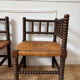 Pair of rush-seated chairs by the fireside "bobbin"