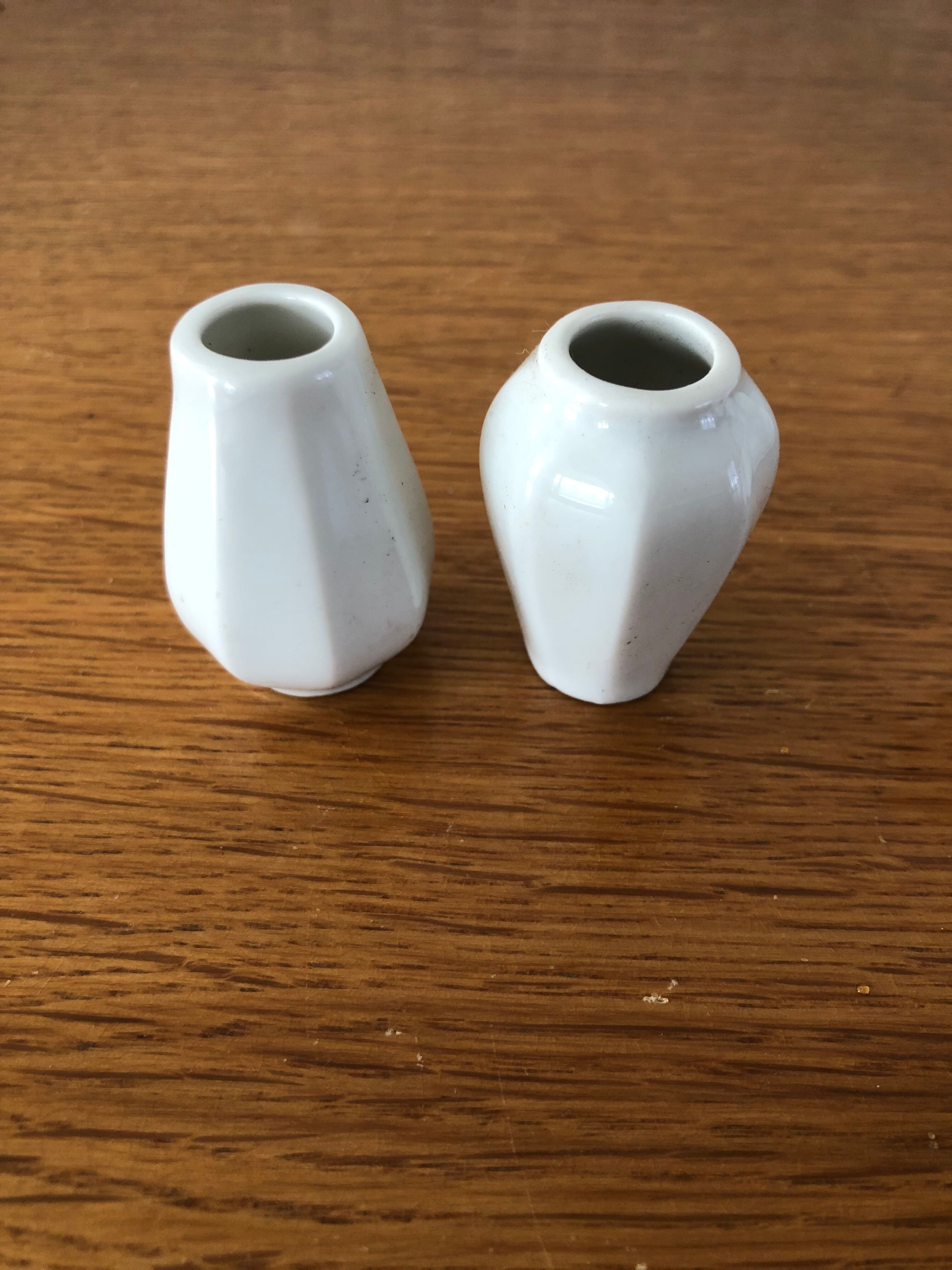 8 miniature vases in white earthenware
