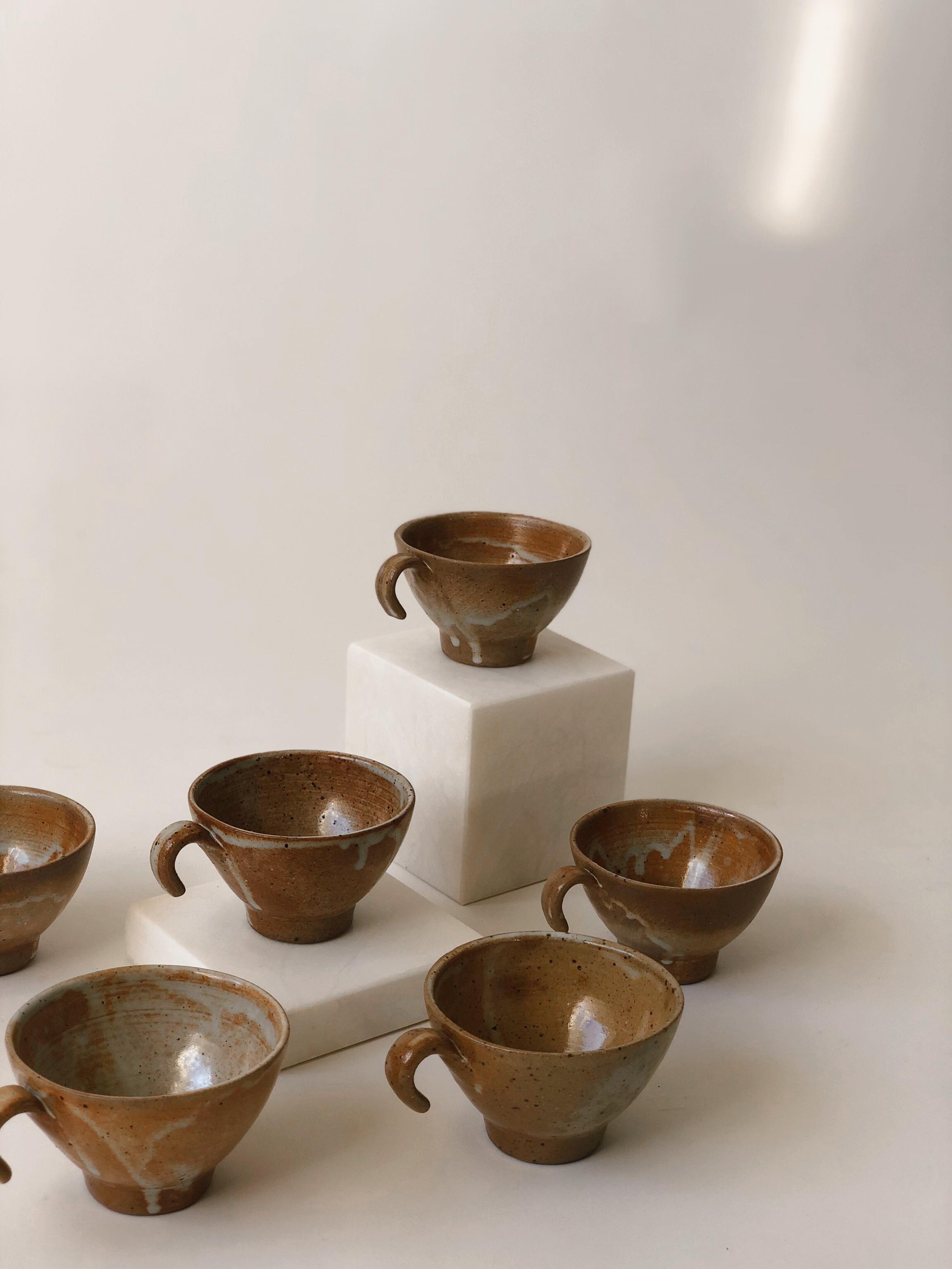 Suite of 6 sandstone cups