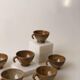 Suite of 6 sandstone cups