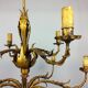 Golden luster with 12 arms of light decorated with leaves 1940