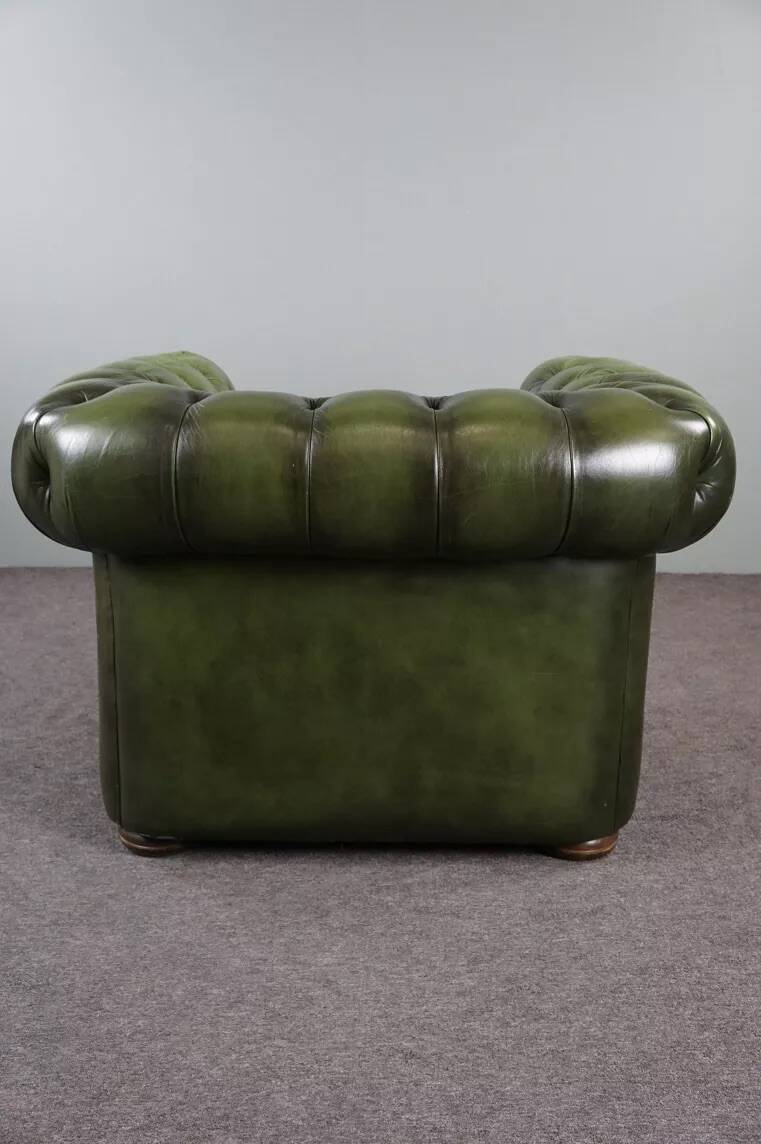 Spacious Chesterfield armchair in green patina