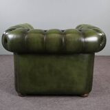 Spacious Chesterfield armchair in green patina