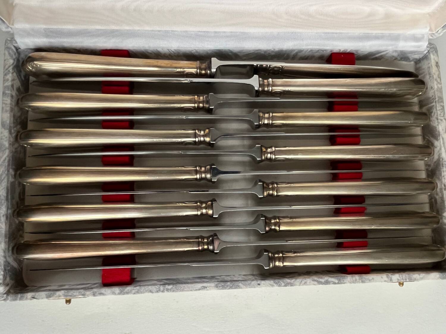 12 silver metal knives