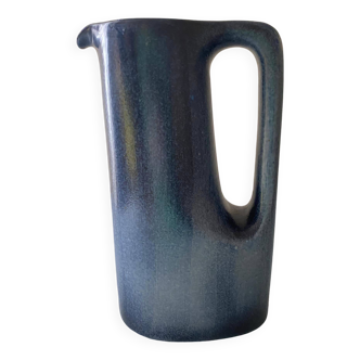 Sleek shaped pitcher in blue shaded ceramic. Signed under the base Stocker Fred and Andrée