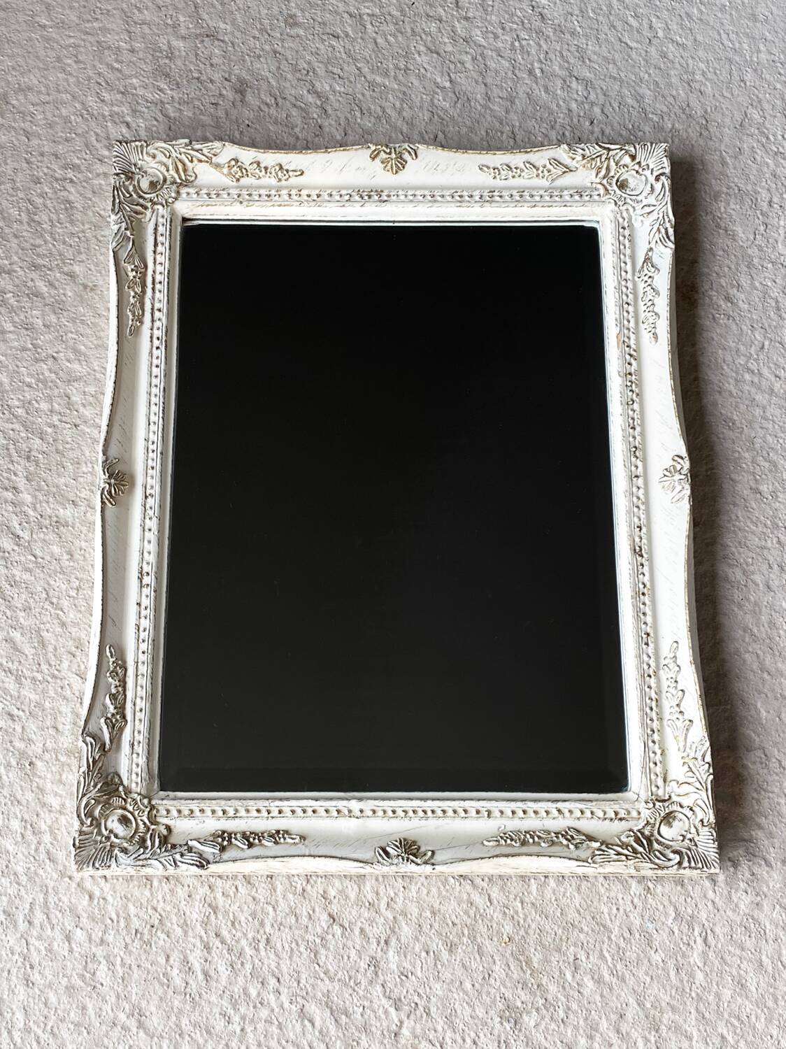 Beveled mirror in carved wood