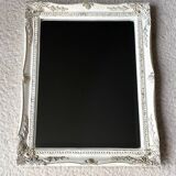 Beveled mirror in carved wood