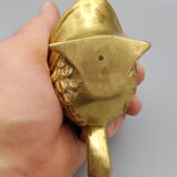Old brass ashtray in the shape of a fish