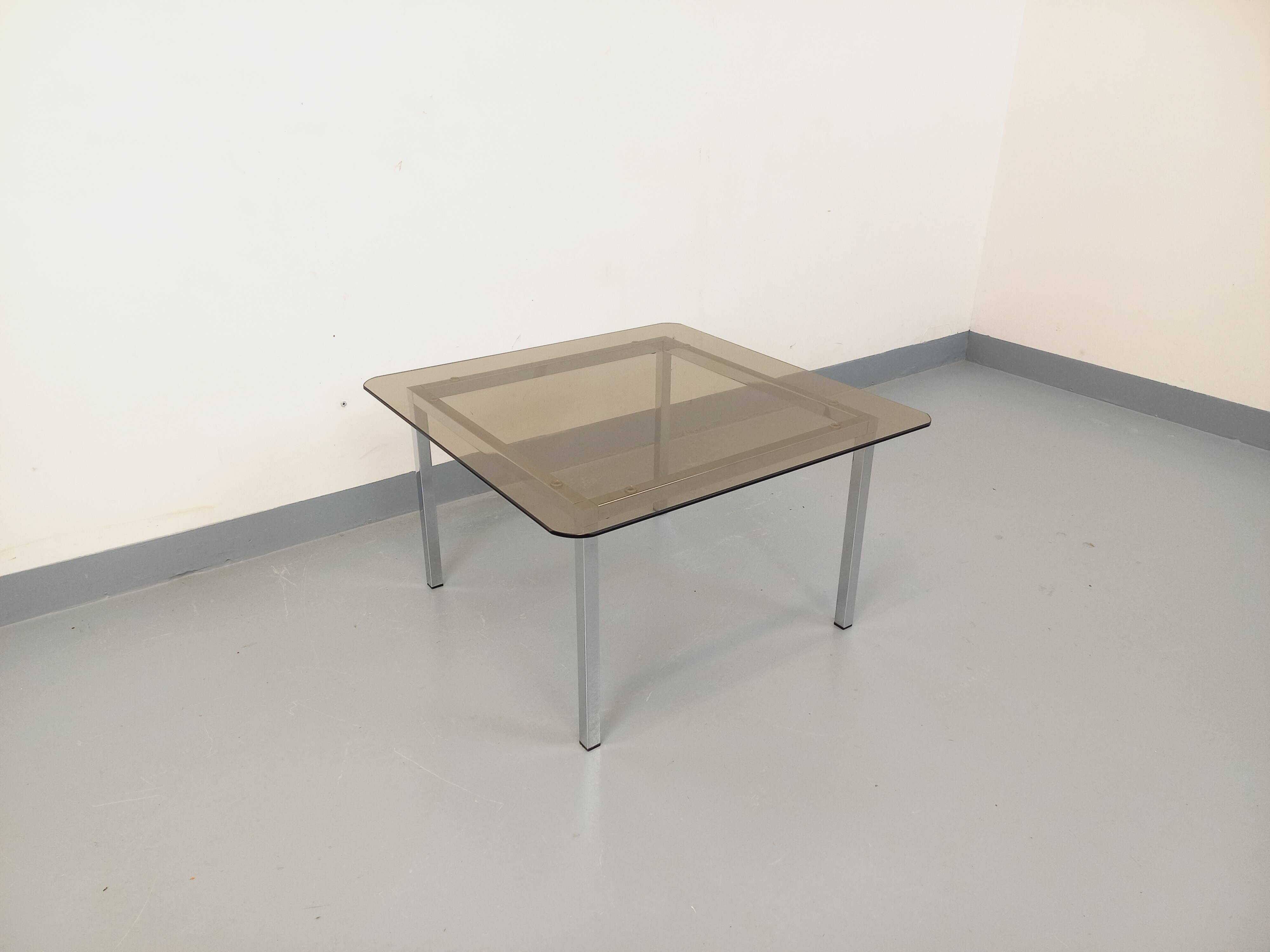 Vintage square coffee table in smoked glass and chrome metal from the 1970s.