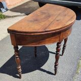 Half moon console opening on a solid walnut round table