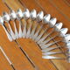 15 small silver metal spoons with rows of beads