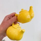 Salt and pepper shakers in the shape of a teapot.