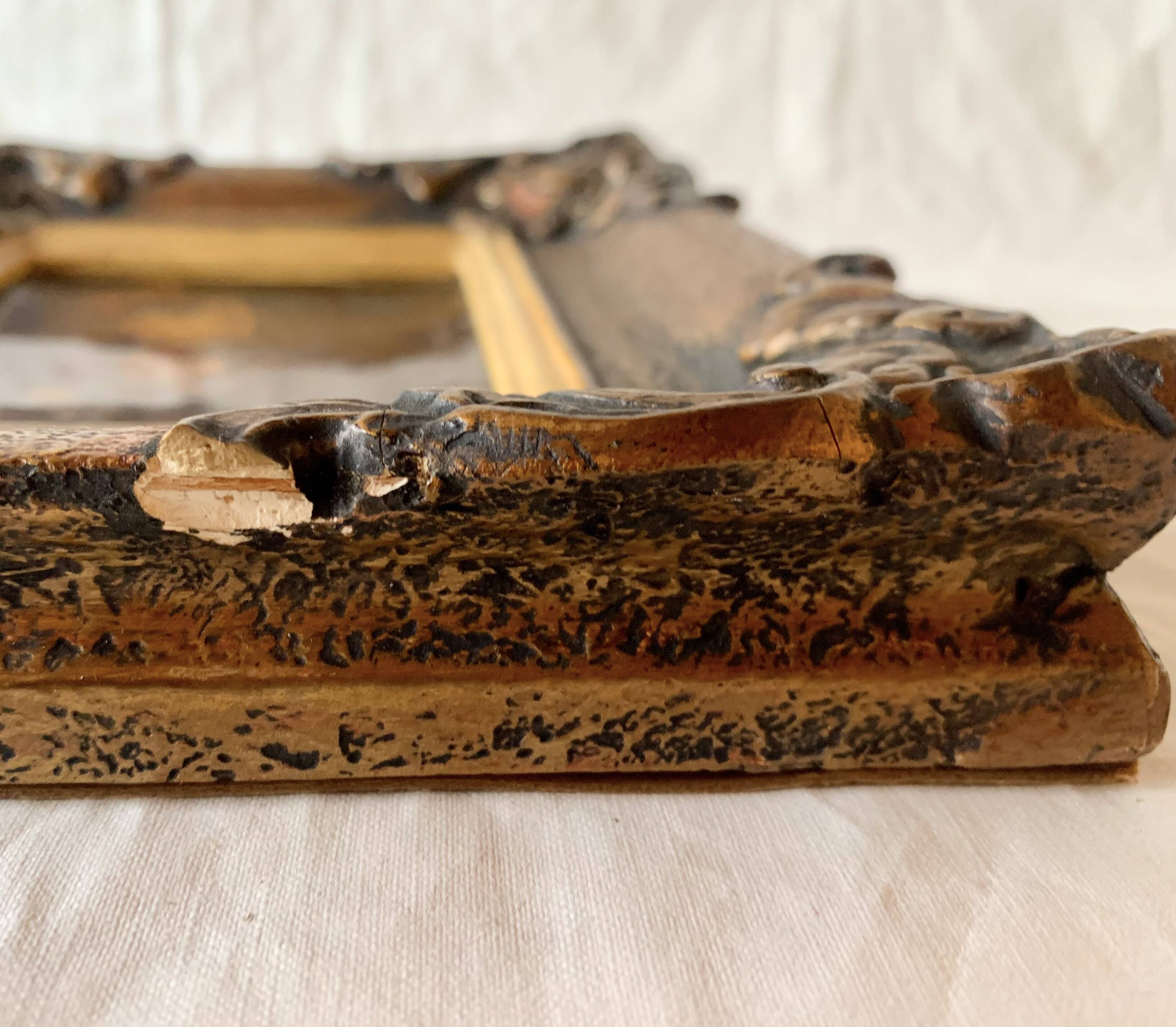 Pair of old carved wooden and plaster frames