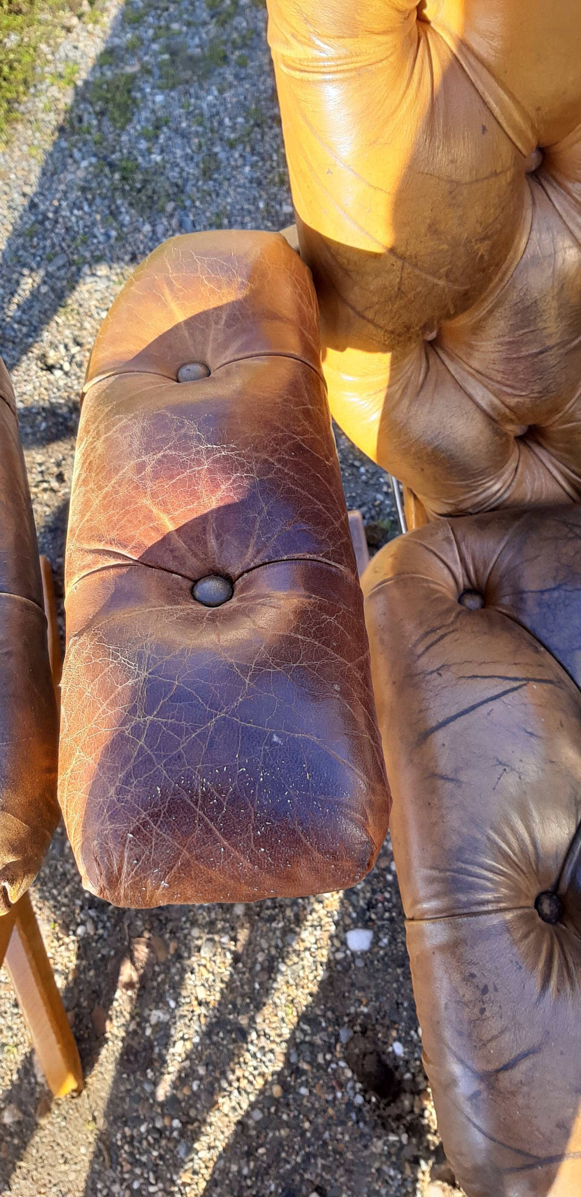 Pair of chesterfield style leather armchairs