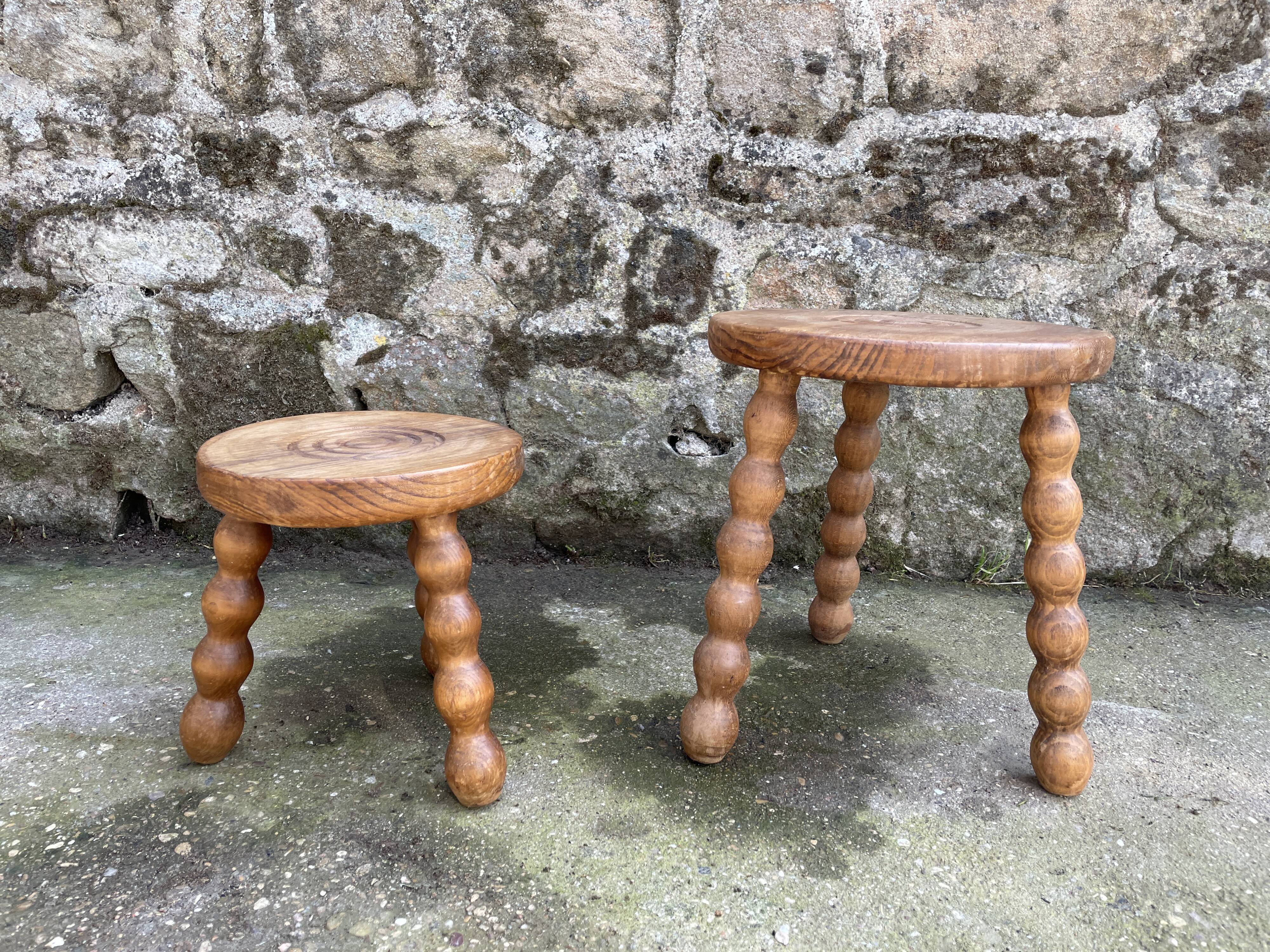 Set of two tripod Breton stools