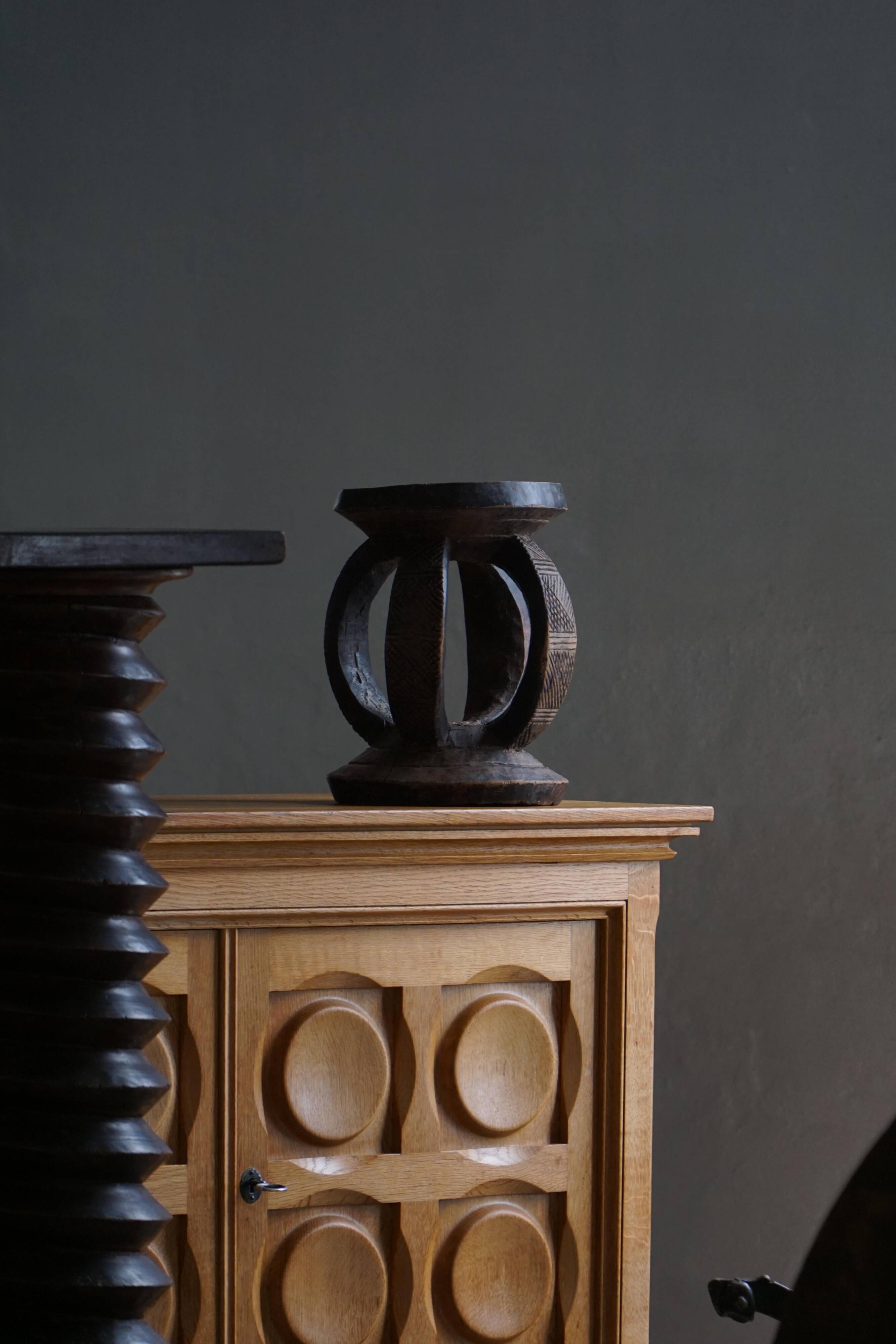 Antique wooden stool hand-carved by the Dogon people of Africa, Wabi-Sabi style, mid-20th century.