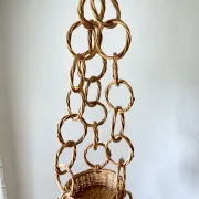 Large wicker suspension with three baskets, twisted ring chain.
